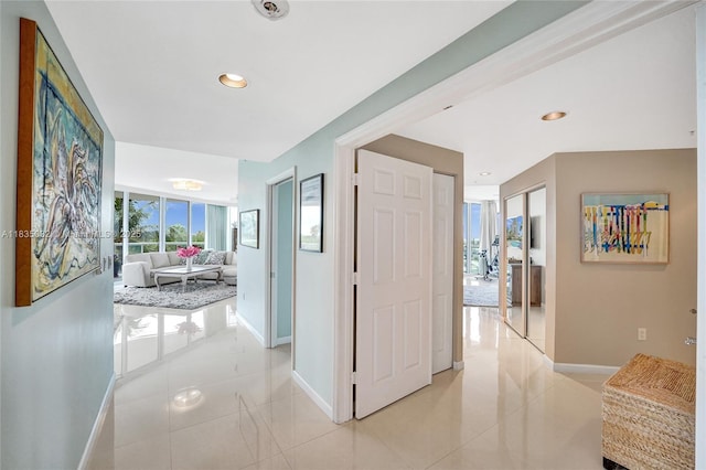 6051 N Ocean Dr Unit 404, Hollywood, FL 33019 - hallway featuring light tile patterned flooring and recessed lighting