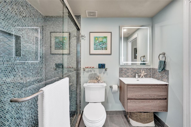 6051 N Ocean Dr Unit 404, Hollywood, FL 33019 - full bathroom featuring vanity, a stall shower, and tile patterned floors