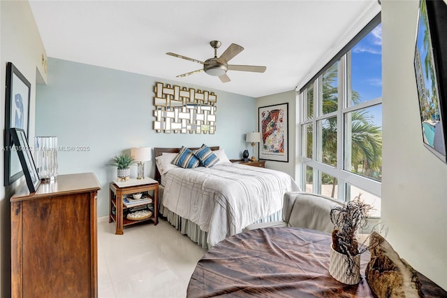 6051 N Ocean Dr Unit 404, Hollywood, FL 33019 - bedroom with light tile patterned flooring and a ceiling fan
