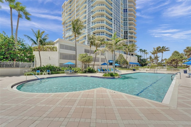 6051 N Ocean Dr Unit 404, Hollywood, FL 33019 - community pool featuring a patio