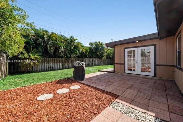 6858 S Congress Ave, Lake Worth, FL 33462 - fenced backyard with french doors and a patio area