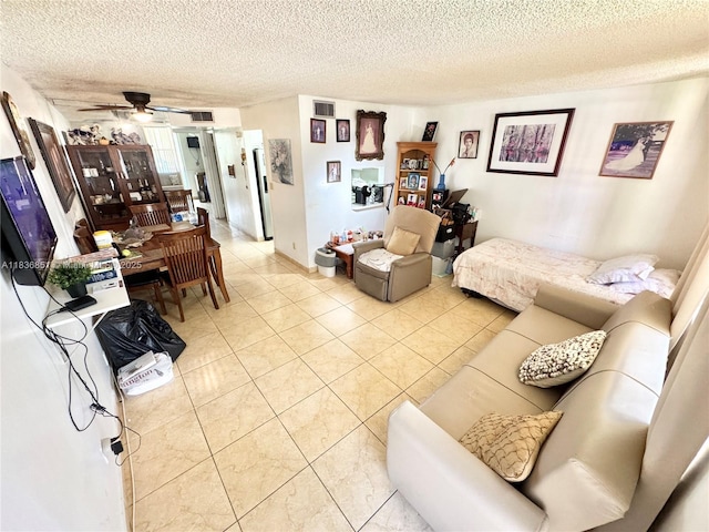 9021 Sunrise Lakes Blvd Unit 104, Sunrise, FL 33322 - living room with light tile patterned floors, ceiling fan, and a textured ceiling
