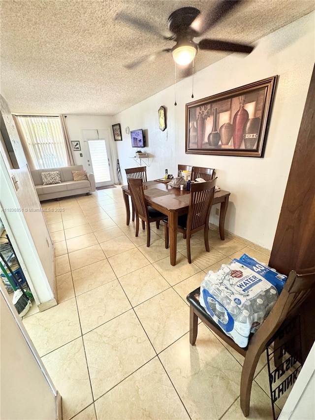 9021 Sunrise Lakes Blvd Unit 104, Sunrise, FL 33322 - dining room with ceiling fan, a textured ceiling, and tile patterned floors