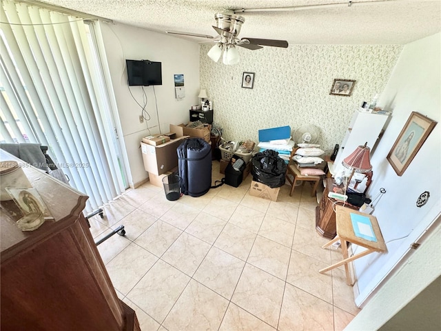 9021 Sunrise Lakes Blvd Unit 104, Sunrise, FL 33322 - living room with ceiling fan, wallpapered walls, a textured ceiling, and light tile patterned floors
