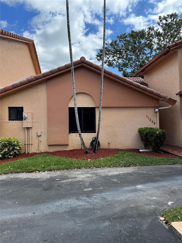 11248 SW 11th St, Pembroke Pines, FL 33025 - view of side of property featuring a tiled roof and stucco siding