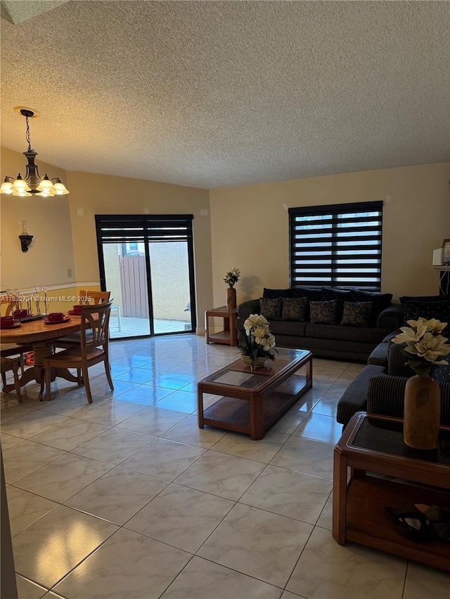 11248 SW 11th St, Pembroke Pines, FL 33025 - living area featuring a textured ceiling, light tile patterned floors, and a chandelier