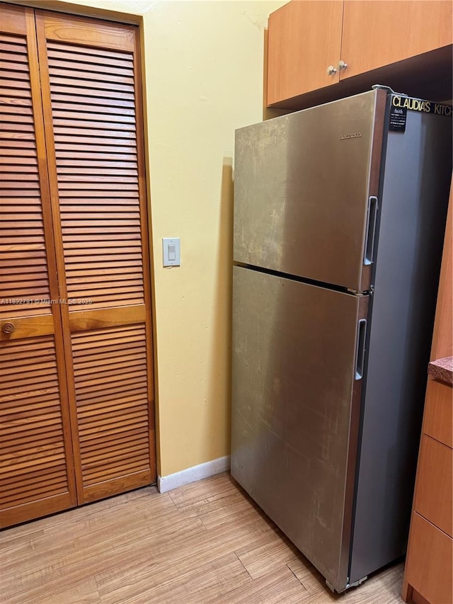 11248 SW 11th St, Pembroke Pines, FL 33025 - kitchen featuring freestanding refrigerator and light wood-style flooring