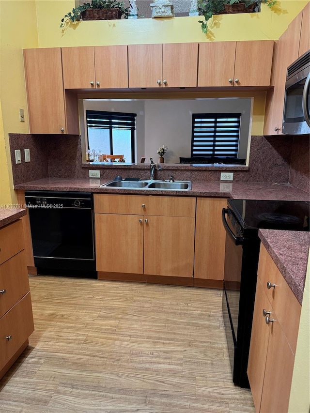 11248 SW 11th St, Pembroke Pines, FL 33025 - kitchen with black appliances, light wood-style floors, backsplash, dark countertops, and light brown cabinetry