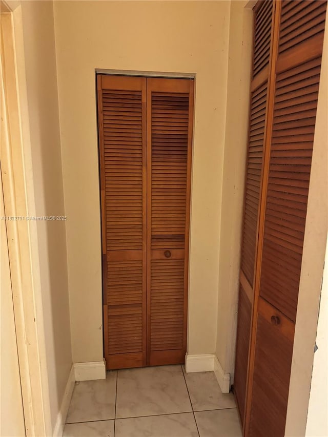 11248 SW 11th St, Pembroke Pines, FL 33025 - hall with light tile patterned floors and baseboards