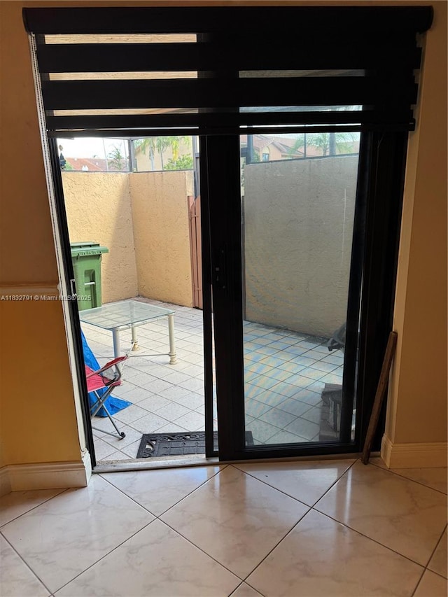 11248 SW 11th St, Pembroke Pines, FL 33025 - doorway to outside featuring baseboards