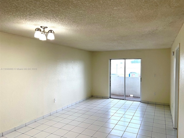 6060 W 21st Ct Unit 205, Hialeah, FL 33016 - unfurnished room featuring a textured ceiling and light tile patterned flooring