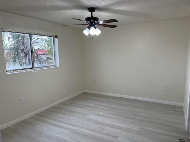 6060 W 21st Ct Unit 205, Hialeah, FL 33016 - empty room featuring a ceiling fan, light wood-style flooring, and a textured ceiling