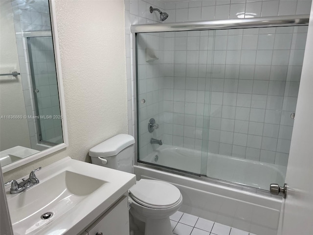 6060 W 21st Ct Unit 205, Hialeah, FL 33016 - full bath featuring a textured wall, vanity, combined bath / shower with glass door, and tile patterned flooring
