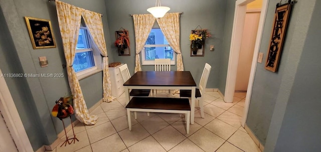 1679 NE 175th St, North Miami Beach, FL 33162 - dining space with light tile patterned floors and baseboards
