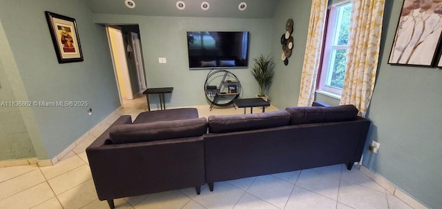 1679 NE 175th St, North Miami Beach, FL 33162 - living room featuring plenty of natural light, vaulted ceiling, and tile patterned flooring