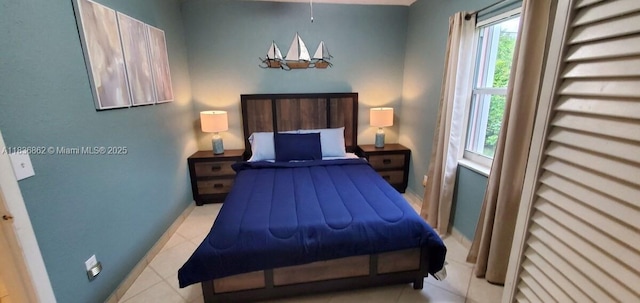 1679 NE 175th St, North Miami Beach, FL 33162 - bedroom featuring light tile patterned floors and baseboards