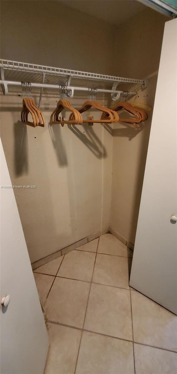 1679 NE 175th St, North Miami Beach, FL 33162 - spacious closet featuring light tile patterned floors