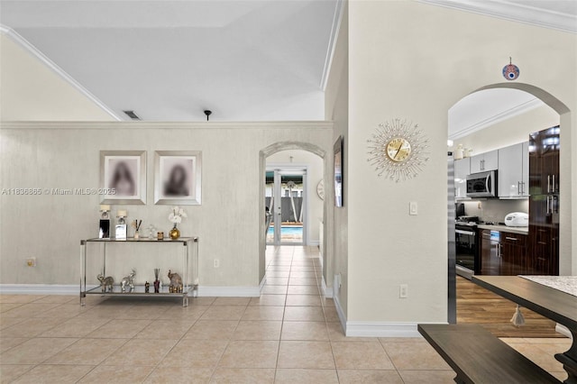 8775 NW 168th St, Miami Lakes, FL 33018 - corridor with arched walkways, light tile patterned floors, and crown molding