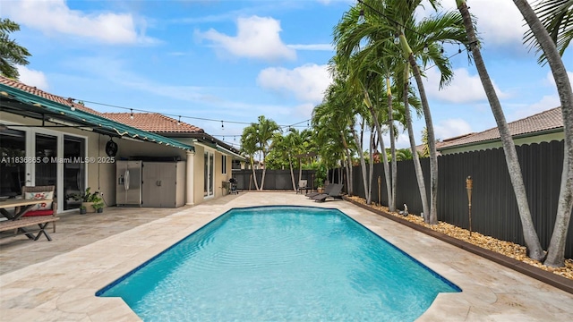 8775 NW 168th St, Miami Lakes, FL 33018 - view of swimming pool with a fenced backyard and a patio area