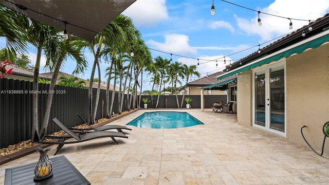 8775 NW 168th St, Miami Lakes, FL 33018 - view of swimming pool with french doors, a patio, and a fenced backyard