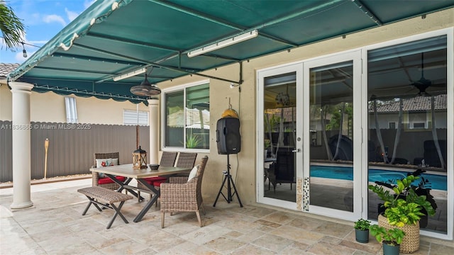 8775 NW 168th St, Miami Lakes, FL 33018 - view of patio featuring outdoor dining space and french doors