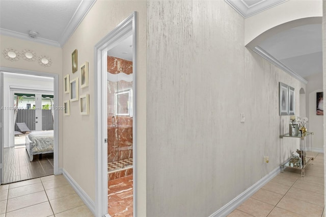 8775 NW 168th St, Miami Lakes, FL 33018 - corridor with arched walkways, ornamental molding, and light tile patterned flooring