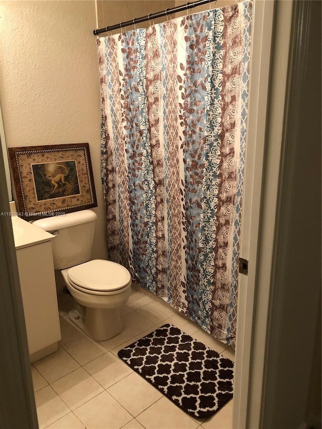 1549 SE 24th Ct Unit 225, Homestead, FL 33035 - bathroom with vanity, a textured wall, tile patterned flooring, and a shower with curtain