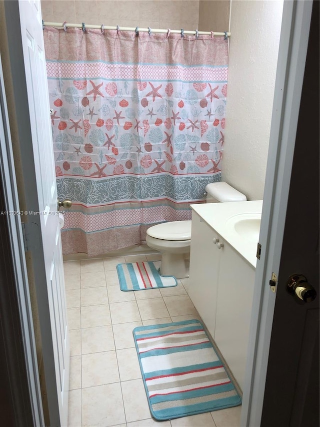 1549 SE 24th Ct Unit 225, Homestead, FL 33035 - full bath featuring vanity, a textured wall, tile patterned floors, and curtained shower