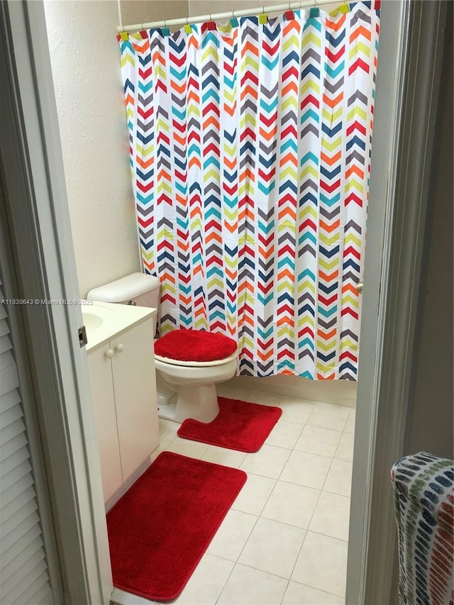1549 SE 24th Ct Unit 225, Homestead, FL 33035 - full bath with vanity, tile patterned flooring, a shower with curtain, and a textured wall