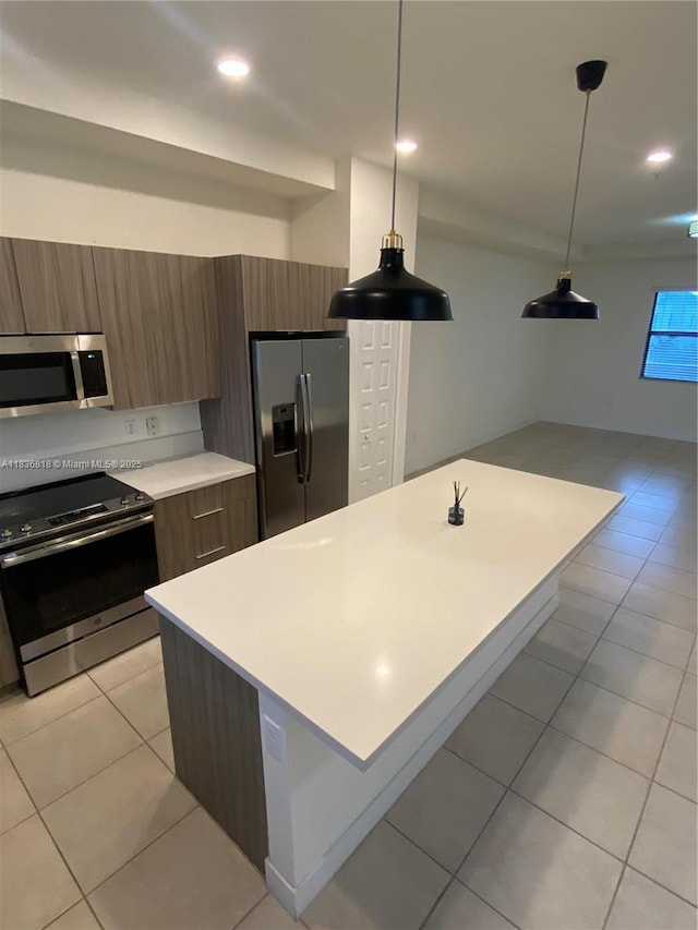 10455 NW 82nd St Unit 33, Doral, FL 33178 - kitchen with appliances with stainless steel finishes, modern cabinets, light countertops, light tile patterned flooring, and open floor plan
