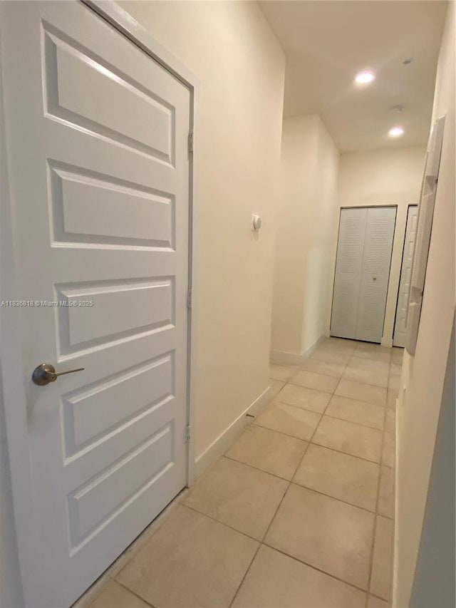 10455 NW 82nd St Unit 33, Doral, FL 33178 - hallway with light tile patterned floors and recessed lighting