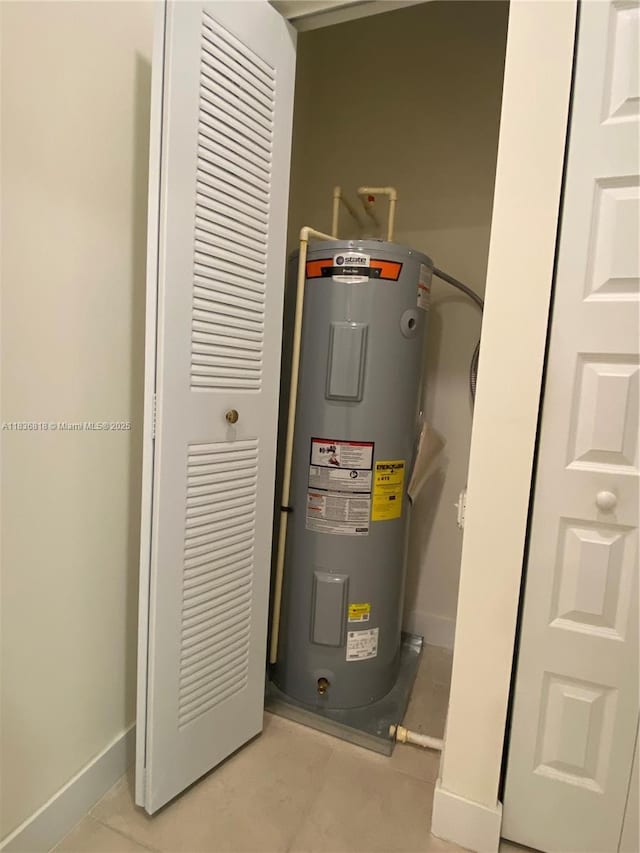 10455 NW 82nd St Unit 33, Doral, FL 33178 - utility room featuring electric water heater