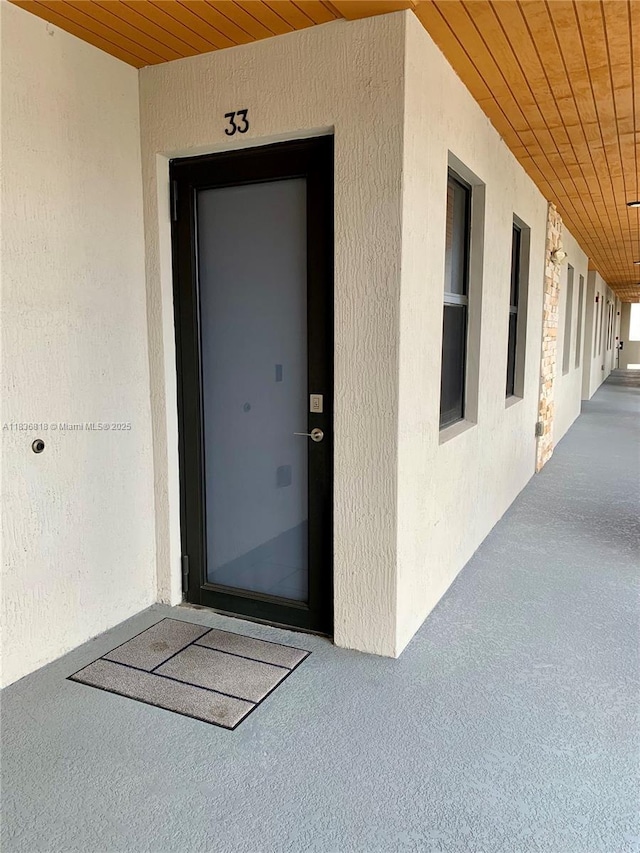 10455 NW 82nd St Unit 33, Doral, FL 33178 - doorway to property featuring stucco siding