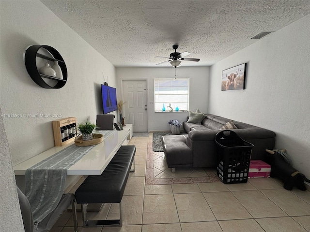 2651 NW 13th St Unit 45, Miami, FL 33125 - living room with a ceiling fan, a textured wall, a textured ceiling, and light tile patterned floors
