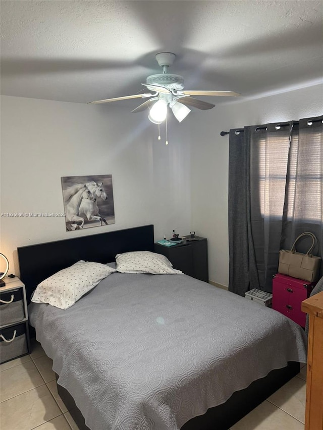 2651 NW 13th St Unit 45, Miami, FL 33125 - bedroom with light tile patterned floors and a ceiling fan