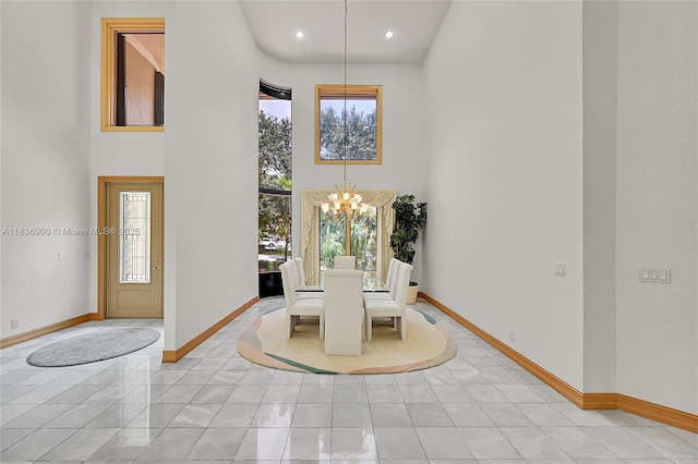 1910 Preston Trl, Coral Springs, FL 33071 - unfurnished dining area with a towering ceiling, a chandelier, and recessed lighting