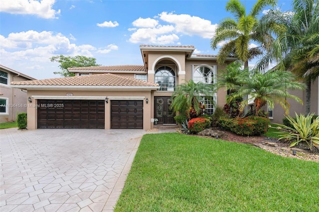 5920 NW 54th Cir, Coral Springs, FL 33067 - mediterranean / spanish-style home featuring stucco siding, a garage, decorative driveway, and a front lawn