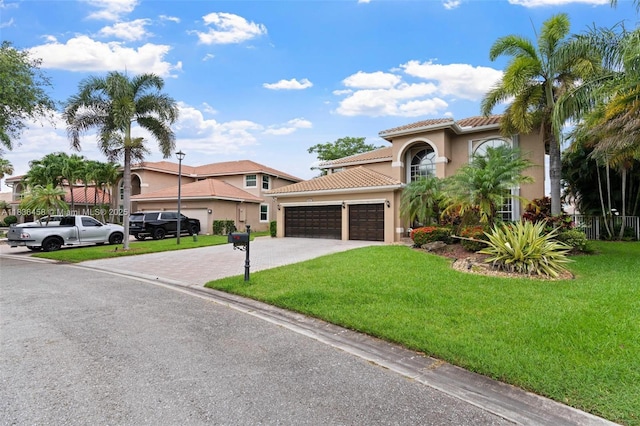 5920 NW 54th Cir, Coral Springs, FL 33067 - mediterranean / spanish-style home with stucco siding, a garage, a tile roof, and driveway