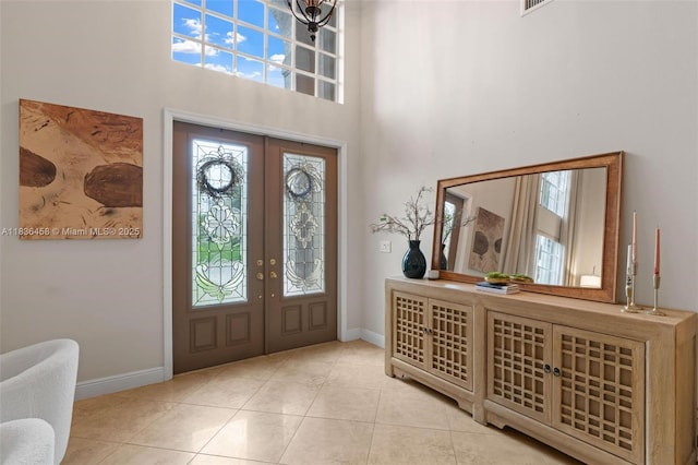 5920 NW 54th Cir, Coral Springs, FL 33067 - tiled foyer entrance featuring french doors, plenty of natural light, and a high ceiling