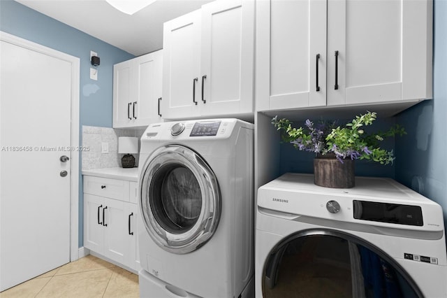 5920 NW 54th Cir, Coral Springs, FL 33067 - washroom with separate washer and dryer, cabinet space, and light tile patterned floors
