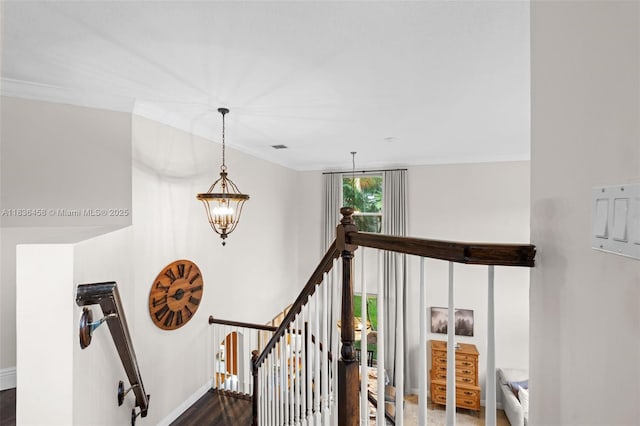 5920 NW 54th Cir, Coral Springs, FL 33067 - staircase with a chandelier, crown molding, and wood finished floors