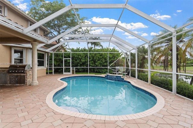 5920 NW 54th Cir, Coral Springs, FL 33067 - outdoor pool featuring an outdoor kitchen, a patio area, and glass enclosure