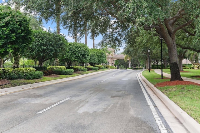 5920 NW 54th Cir, Coral Springs, FL 33067 - view of asphalt road with street lighting and curbs