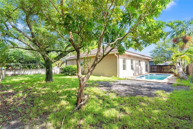 955 S 26th Ave, Hollywood, FL 33020 - rear view of property featuring stucco siding and a fenced backyard