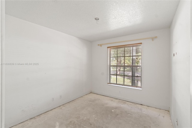 955 S 26th Ave, Hollywood, FL 33020 - spare room with a textured ceiling and concrete floors