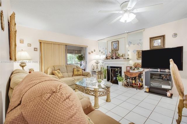 5100 Washington St Unit 211, Hollywood, FL 33021 - living room with light tile patterned flooring, a ceiling fan, and a fireplace