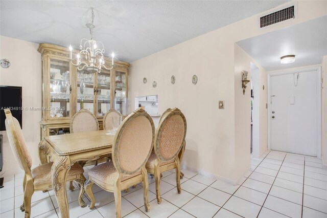 5100 Washington St Unit 211, Hollywood, FL 33021 - dining area with a chandelier and light tile patterned floors