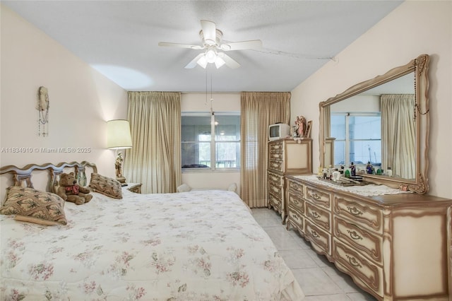 5100 Washington St Unit 211, Hollywood, FL 33021 - bedroom featuring light tile patterned floors and a ceiling fan