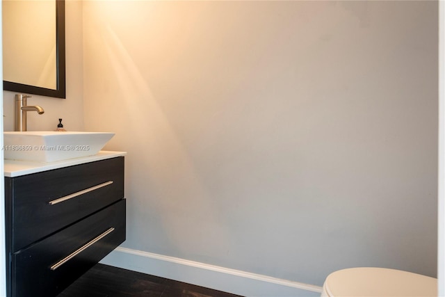 1606 Veracruz Ln, Weston, FL 33327 - half bathroom featuring vanity and wood finished floors