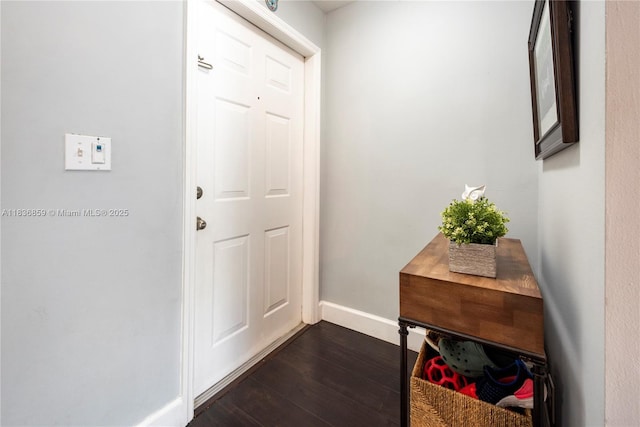 1606 Veracruz Ln, Weston, FL 33327 - doorway to outside featuring dark wood-type flooring and baseboards